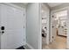 Bright entryway featuring a white front door and views of a bedroom and bathroom at 450 Intrepid Ct, Boulder City, NV 89005