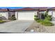 Charming single-story home with a two-car garage and well-manicured landscaping at 450 Intrepid Ct, Boulder City, NV 89005