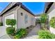 Charming home with a two-car garage, walkway, gated courtyard, and manicured landscaping at 450 Intrepid Ct, Boulder City, NV 89005