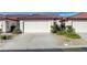 Charming single-story home with a two-car garage and well-manicured landscaping at 450 Intrepid Ct, Boulder City, NV 89005