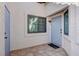 Charming tiled entryway with a gray front door, a sidelight window, and a carriage light at 450 Intrepid Ct, Boulder City, NV 89005