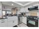 Updated kitchen featuring stainless steel appliances and a farmhouse sink at 450 Intrepid Ct, Boulder City, NV 89005