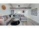 Spacious living room with sectional sofa, lofted beam and an open layout to kitchen area at 450 Intrepid Ct, Boulder City, NV 89005