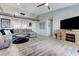 Open-concept living room with comfortable seating, modern entertainment center, and neutral color palette at 450 Intrepid Ct, Boulder City, NV 89005