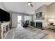 Living room featuring a fireplace, neutral decor, and access to outdoor space at 450 Intrepid Ct, Boulder City, NV 89005