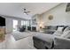 Comfortable living room with fireplace, plush sectional sofa and access to outdoor space at 450 Intrepid Ct, Boulder City, NV 89005