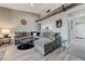 Cozy living room with large sectional sofa, rustic accents, and open access to kitchen at 450 Intrepid Ct, Boulder City, NV 89005