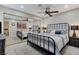 Main bedroom with mirrored closet, ceiling fan, and neutral decor at 450 Intrepid Ct, Boulder City, NV 89005