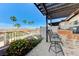 Beautiful covered patio that has a built-in outdoor kitchen that overlooks lush landscaping and mountain views at 450 Intrepid Ct, Boulder City, NV 89005