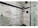 Shower featuring modern tile, glass enclosure, and matte black hardware at 450 Intrepid Ct, Boulder City, NV 89005
