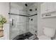 Shower featuring modern tile, glass enclosure, and matte black hardware at 450 Intrepid Ct, Boulder City, NV 89005