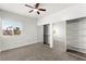 Bright bedroom featuring large windows, carpet flooring, and sliding door closets at 4655 Gold Dust Ave # 210, Las Vegas, NV 89120