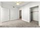 Bright bedroom with a ceiling fan, carpet flooring, walk-in closet, and attached bathroom at 4655 Gold Dust Ave # 210, Las Vegas, NV 89120