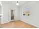 Cozy dining area featuring wood-look floors, a door, and a window for great natural light at 4655 Gold Dust Ave # 210, Las Vegas, NV 89120