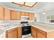 Kitchen with bright counter tops, wooden cabinets and gas range at 4655 Gold Dust Ave # 210, Las Vegas, NV 89120