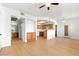 Open floor plan with wood floors leading to the kitchen and bathroom and ceiling fan for comfort at 4655 Gold Dust Ave # 210, Las Vegas, NV 89120