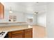 Bright living room with wood-look floors and a ceiling fan, bathed in natural light from large windows at 4655 Gold Dust Ave # 210, Las Vegas, NV 89120