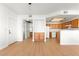 Open-concept living room and kitchen area, featuring wood floors and natural light at 4655 Gold Dust Ave # 210, Las Vegas, NV 89120