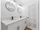 Modern bathroom with double sinks, marble countertops and stylish vanity with black hardware at 517 N 22Nd St, Las Vegas, NV 89101