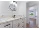 Modern bathroom vanity with white cabinets, black hardware, and stylish quartz countertop at 517 N 22Nd St, Las Vegas, NV 89101