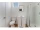 Bathroom featuring modern fixtures, a vanity, toilet, and a shower with glass doors at 517 N 22Nd St, Las Vegas, NV 89101