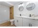 Modern bathroom with double sink vanity, stylish mirrors, and a walk-in shower at 517 N 22Nd St, Las Vegas, NV 89101