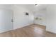 Bedroom features light hardwood flooring, bright white walls and a window at 517 N 22Nd St, Las Vegas, NV 89101