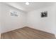 Bright bedroom featuring wood floors, white walls, and a window at 517 N 22Nd St, Las Vegas, NV 89101