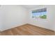 Cozy bedroom with natural light, wood-look floors, and neutral walls at 517 N 22Nd St, Las Vegas, NV 89101
