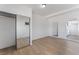Bedroom features light hardwood flooring, walk in closet and doorways to other rooms at 517 N 22Nd St, Las Vegas, NV 89101