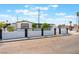 Charming single-story home featuring manicured landscaping and a secure fence at 517 N 22Nd St, Las Vegas, NV 89101