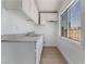 Bright kitchen features stainless steel sink, white cabinetry, and window providing ample natural light at 517 N 22Nd St, Las Vegas, NV 89101