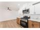 Contemporary kitchen with stainless steel appliances, marble counters, and stylish cabinetry at 517 N 22Nd St, Las Vegas, NV 89101