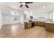 Open-concept living space flowing into a kitchen with stainless steel appliances and mixed wood-tone cabinets at 517 N 22Nd St, Las Vegas, NV 89101