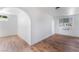 Bright living room featuring hardwood floors, white trim, and multiple windows, offering a clean and open space at 517 N 22Nd St, Las Vegas, NV 89101