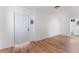 Bright living room with hardwood floors, a front door and a view into the bathroom and the kitchen at 517 N 22Nd St, Las Vegas, NV 89101