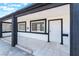 Charming tiled front porch featuring contrasting trim and a secure front door at 517 N 22Nd St, Las Vegas, NV 89101