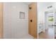 Contemporary shower with subway tile, niche, matte black fixtures, and wood accent at 517 N 22Nd St, Las Vegas, NV 89101