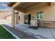 Covered patio featuring BBQ, sliding glass door, and exterior space perfect for outdoor dining at 5229 Giallo Vista Ct, North Las Vegas, NV 89031