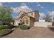 View of the house, with a decorative star, desert landscaping, and a painted fence at 5229 Giallo Vista Ct, North Las Vegas, NV 89031
