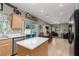 Bright kitchen offering stainless appliances, island seating, and seamless flow to Gathering area at 5229 Giallo Vista Ct, North Las Vegas, NV 89031