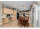 Eat-in kitchen with wooden table, cabinets, stainless steel appliances and a built-in desk at 5229 Giallo Vista Ct, North Las Vegas, NV 89031
