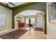 An open living area with laminate floors and decorative rugs, paint scheme is neutral and calming at 5229 Giallo Vista Ct, North Las Vegas, NV 89031