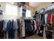 Walk-in closet with ample storage racks, hanging rods, and shoe storage at 5229 Giallo Vista Ct, North Las Vegas, NV 89031