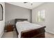 Cozy bedroom with neutral paint, and a comfortable bed topped with a white and gray comforter at 5616 Silver Cascade Ave, Las Vegas, NV 89131