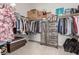 Walk-in closet with built-in shelving, hanging racks, and a dresser for ample storage at 5616 Silver Cascade Ave, Las Vegas, NV 89131