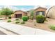 Charming home exterior with well-manicured landscaping and a spacious driveway at 5616 Silver Cascade Ave, Las Vegas, NV 89131