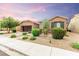 Charming single-story home with beautiful landscaping and a two-car garage at 5616 Silver Cascade Ave, Las Vegas, NV 89131