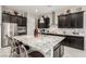 Stylish kitchen featuring granite countertops, stainless steel appliances and a central island with seating at 5616 Silver Cascade Ave, Las Vegas, NV 89131