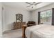 Cozy bedroom featuring a large bed, a decorative dresser, and a comfortable accent chair at 5616 Silver Cascade Ave, Las Vegas, NV 89131